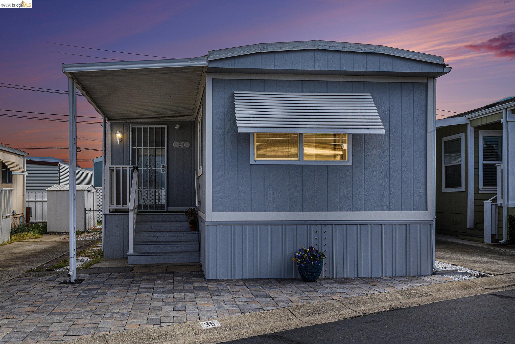 36 Cayuga Street Oakley, CA 94561 - Photo 4 of 25 Manufactured / mobile home featuring a storage unit and a porch