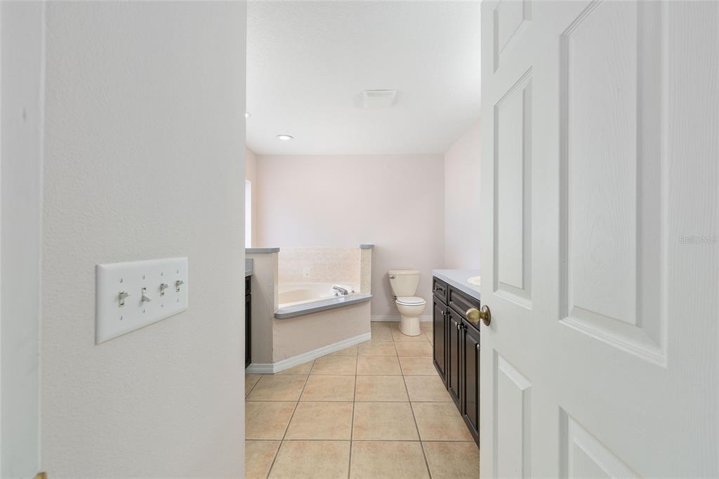 15434 Southwest 23rd Court Road Ocala, FL 34473 - Photo 25 of 41 a hallway with a washer and dryer