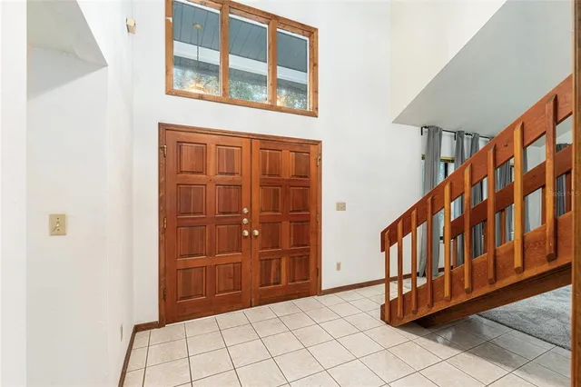 a large kitchen with stainless steel appliances granite countertop a large stove a sink dishwasher and a refrigerator with the cabinets