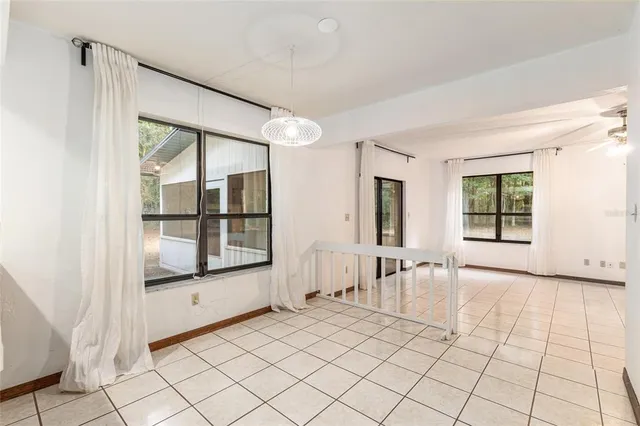 a view of an empty room with a large window