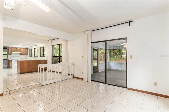 a view of a house with a yard and tree s