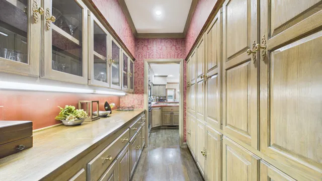 a spacious bathroom with a granite countertop sink and a mirror