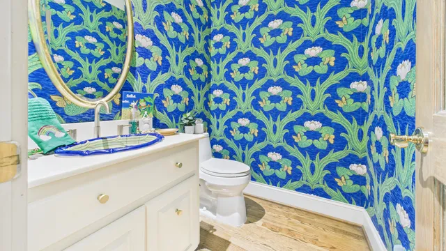 a dining room with furniture and wooden floor