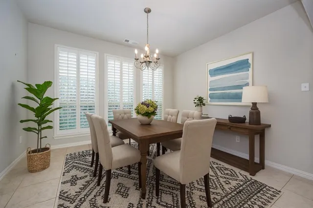a view of a house with yard and porch