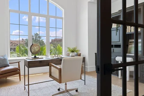 a room with a large window and table