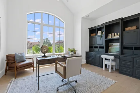 a living room with furniture window and wooden floor