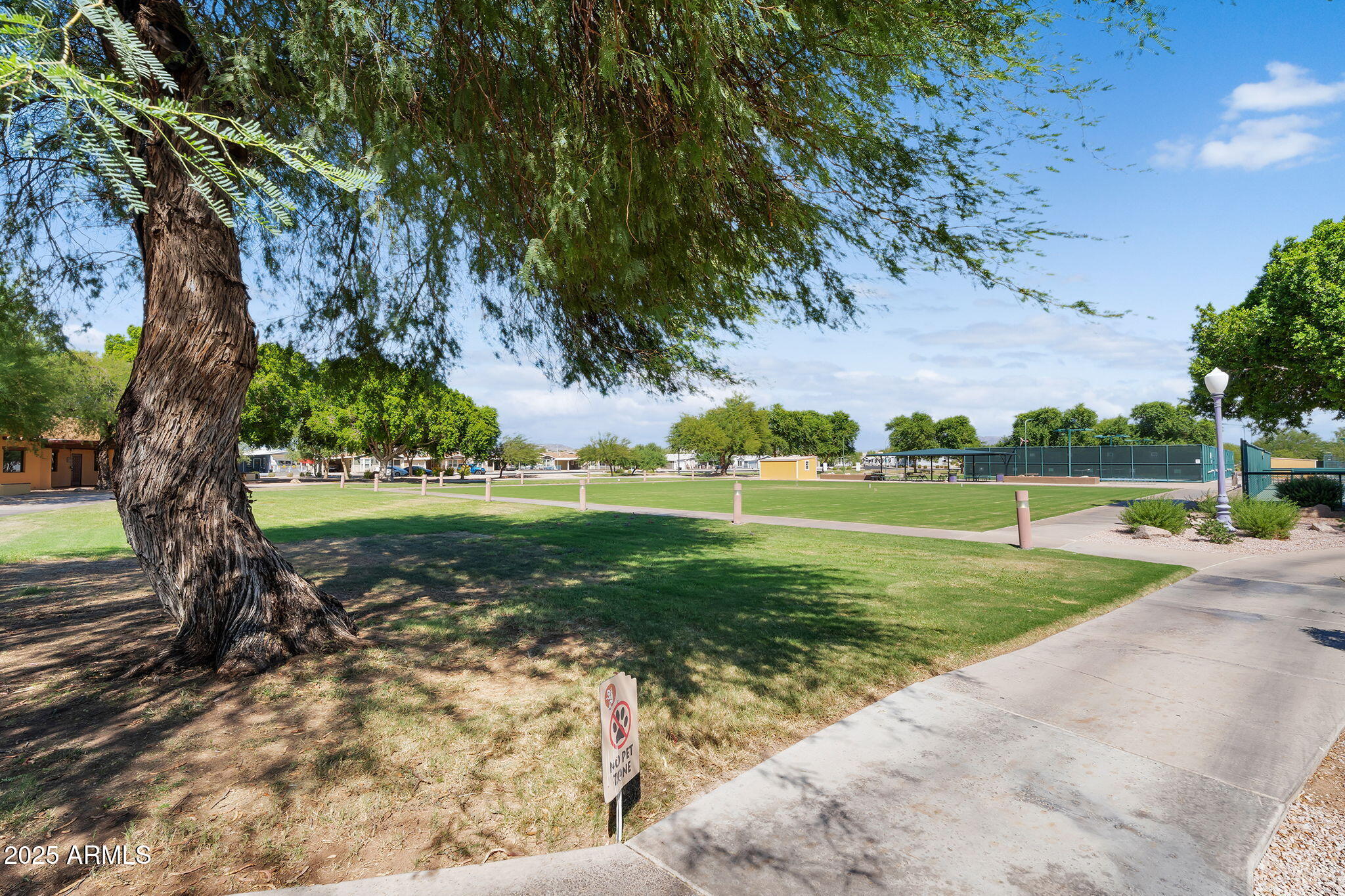 8865 East Baseline Road, Unit 802 Mesa, AZ 85209 - Photo 39 of 44 a view of a golf course with a lake view