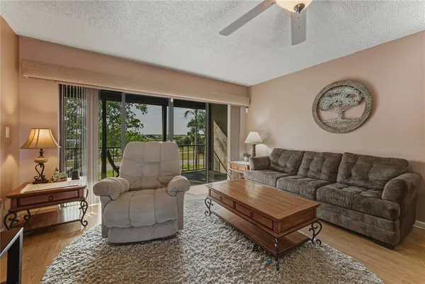 a living room with furniture and a large window