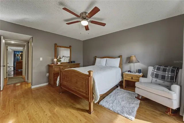 a bedroom with a bed and a couch