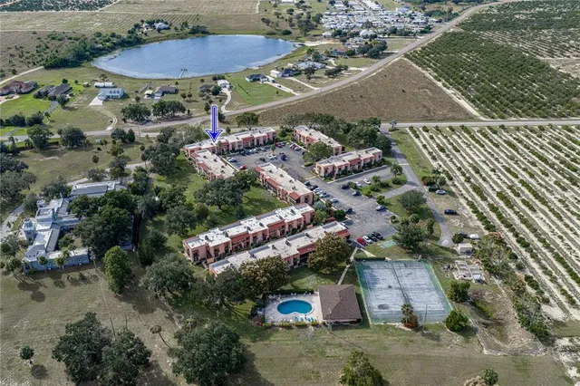 an aerial view of a house with outdoor space