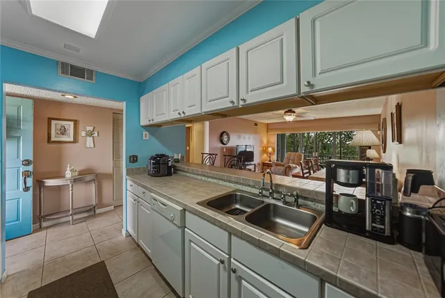 a kitchen with a sink and cabinets