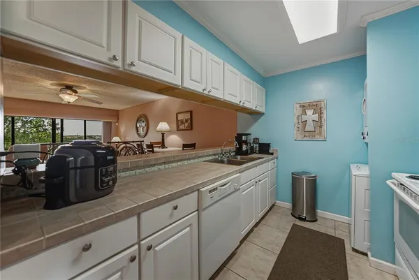 a kitchen with stainless steel appliances granite countertop a sink and cabinets