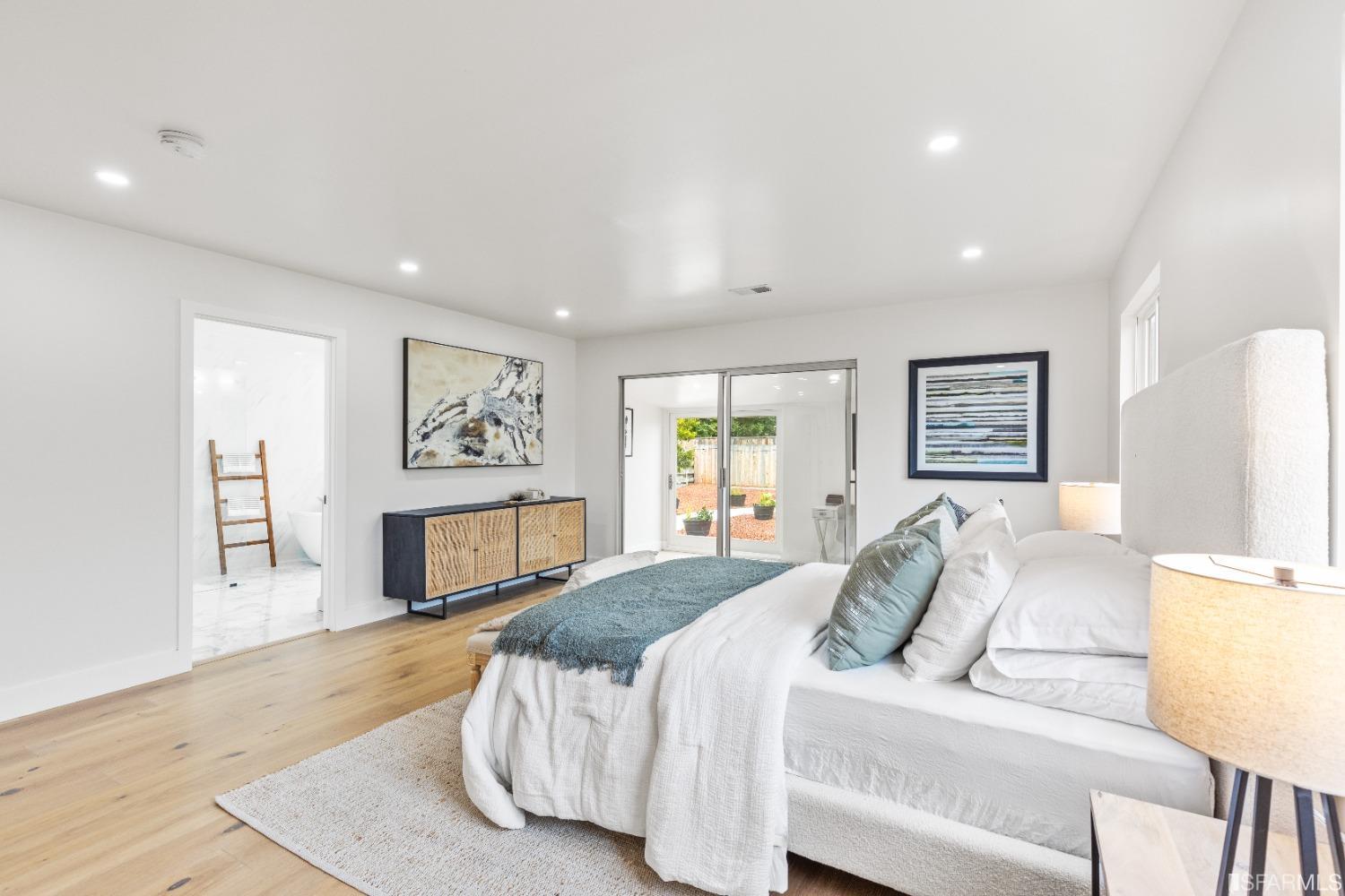 1139 Peralta Road Pacifica, CA 94044 - Photo 18 of 58 a spacious bedroom with a large bed and a couch
