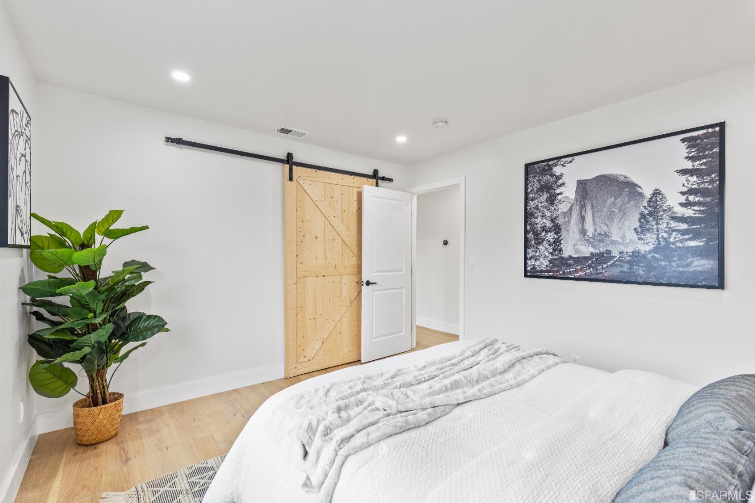 1139 Peralta Road Pacifica, CA 94044 - Photo 29 of 58 a bedroom with a bed and a painting on the wall