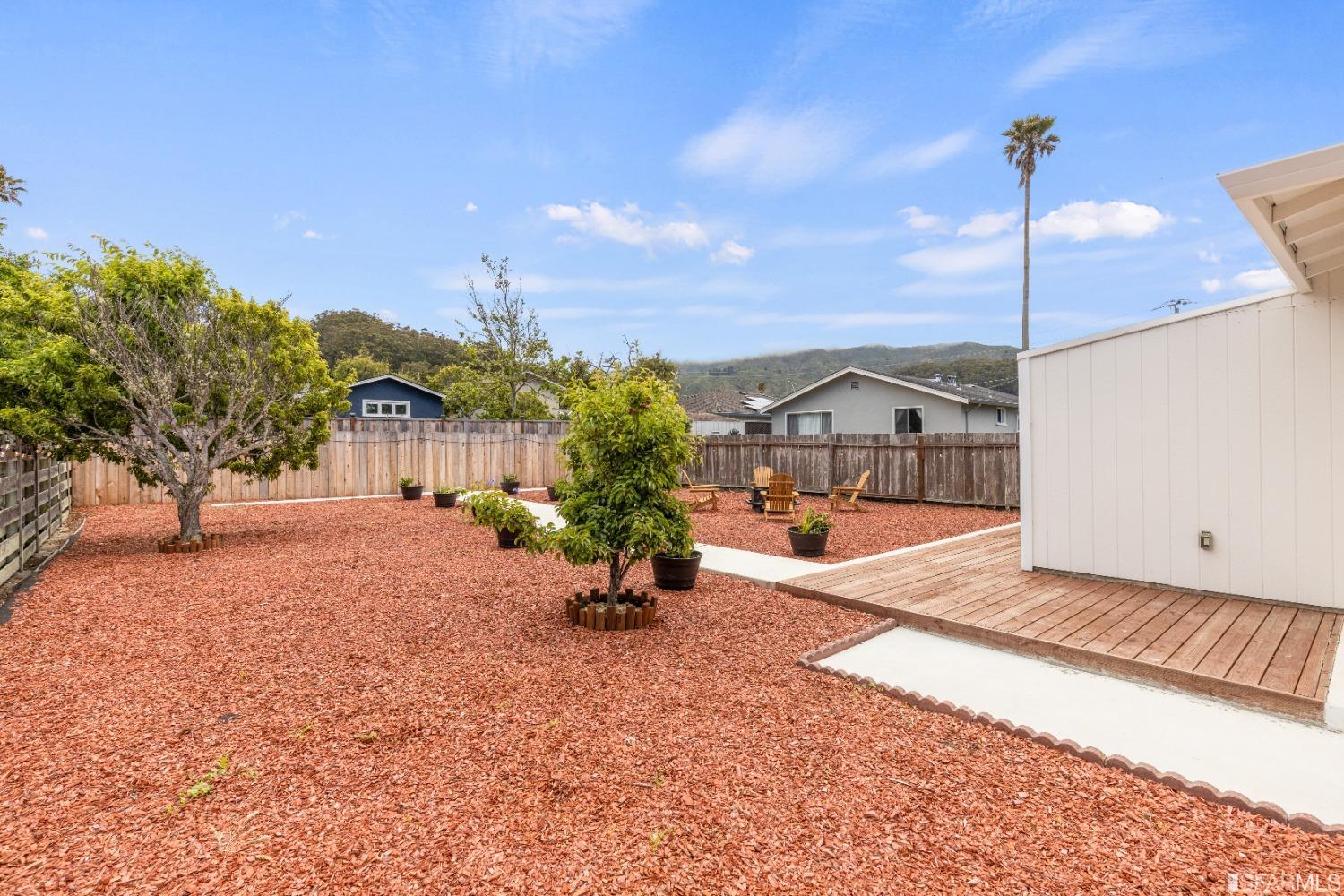 1139 Peralta Road Pacifica, CA 94044 - Photo 42 of 58 a view of a house with backyard and garden