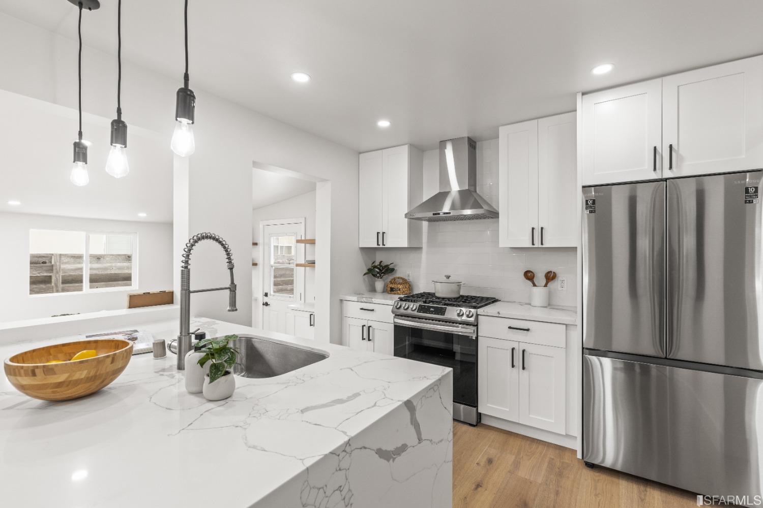 1139 Peralta Road Pacifica, CA 94044 - Photo 10 of 58 a kitchen with stainless steel appliances a sink a stove a refrigerator and cabinets