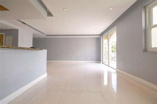 a view of a kitchen with a dishwasher and a window