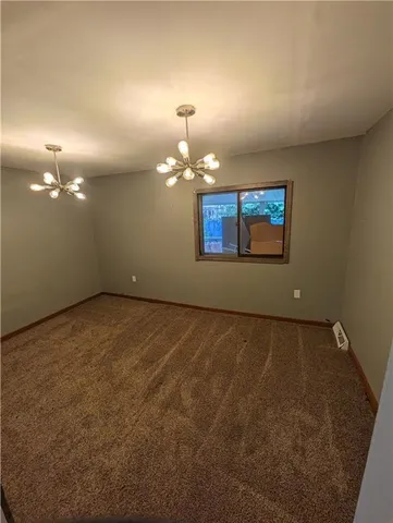 a view of a room with a chandelier