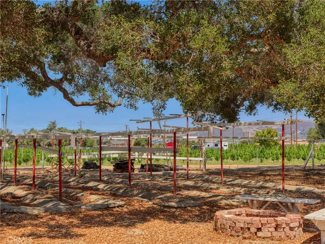 a view of a chair and table in the patio