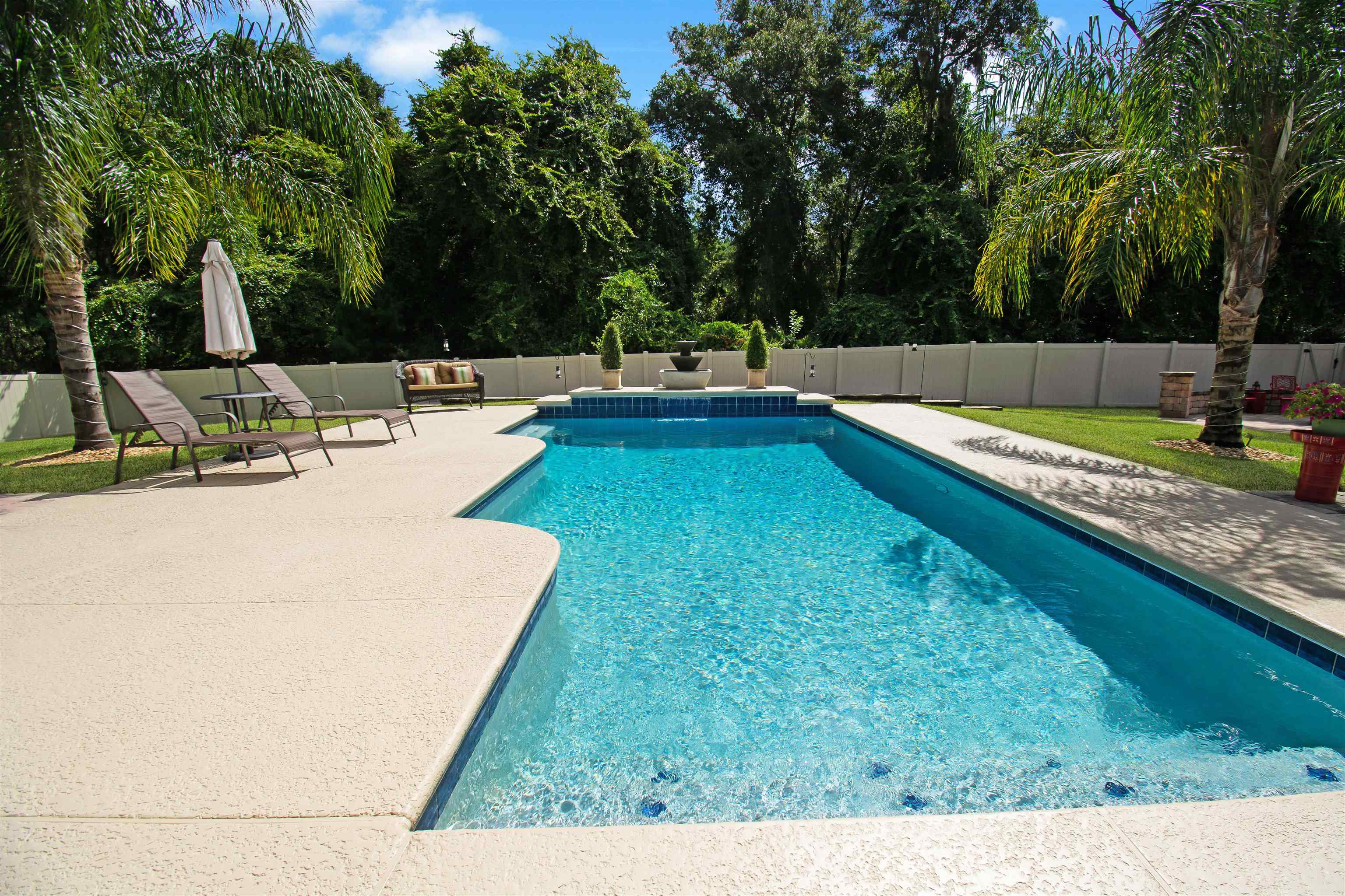 3461 Kings Road St. Augustine, FL 32086 - Photo 3 of 45 a view of a swimming pool with a patio