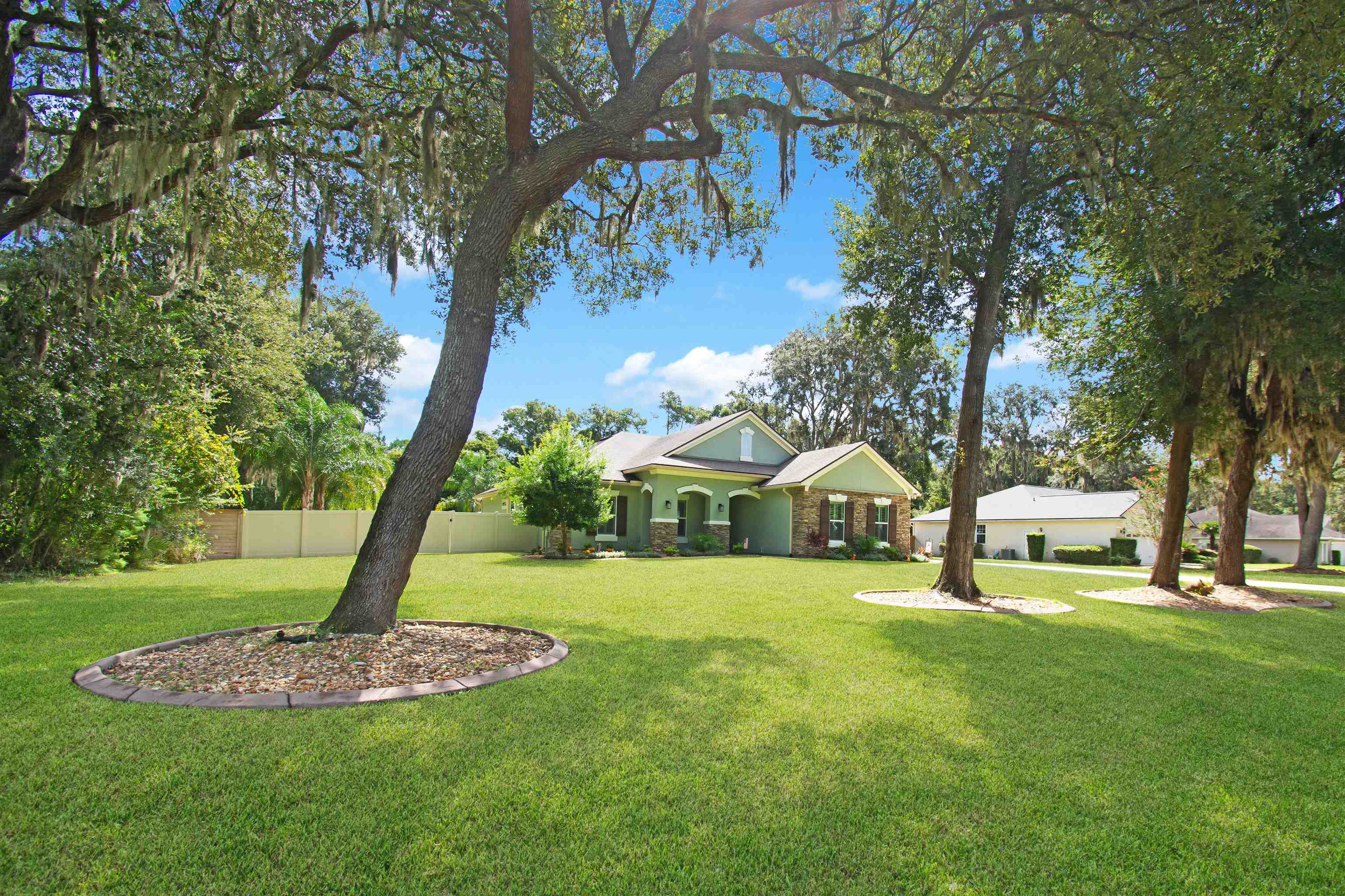 3461 Kings Road St. Augustine, FL 32086 - Photo 44 of 45 a front view of a house with a yard and trees