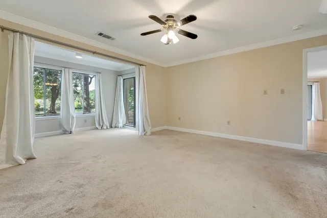 a view of empty room with floor to ceiling window