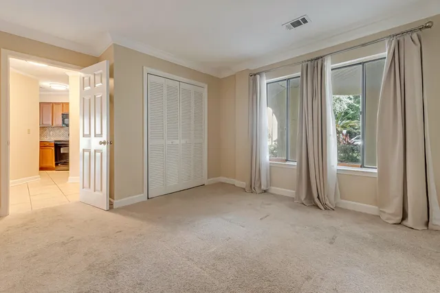 a view of kitchen with furniture and stainless steel appliances