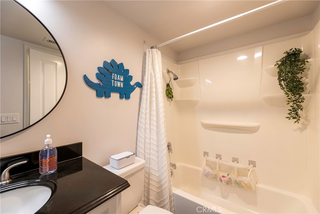 20702 El Toro Road, Unit 178 Lake Forest, CA 92630 - Photo 15 of 30 a bathroom with a sink and a mirror