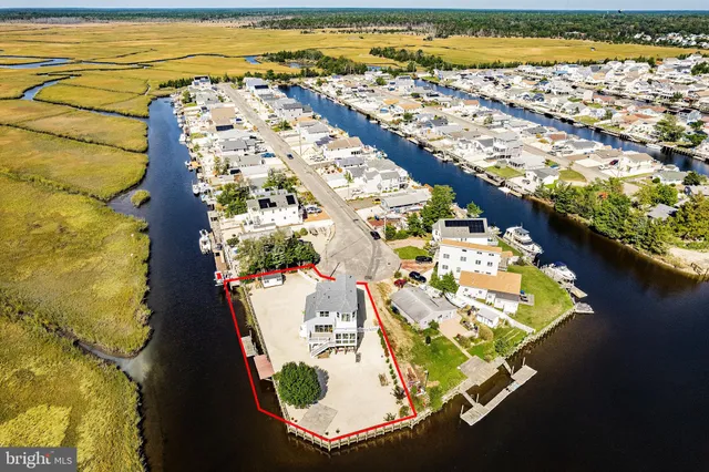 an aerial view of a house with a ocean view