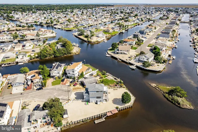 a view of a balcony with wooden floor and fence