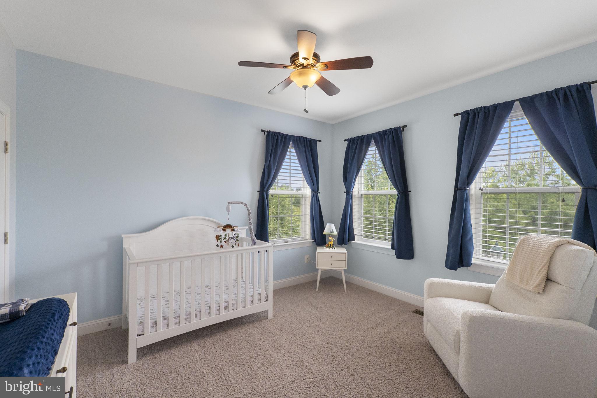 23902 Grapevine Ridge Terrace Clarksburg, MD 20871 - Photo 21 of 44 a living room with furniture and a large window