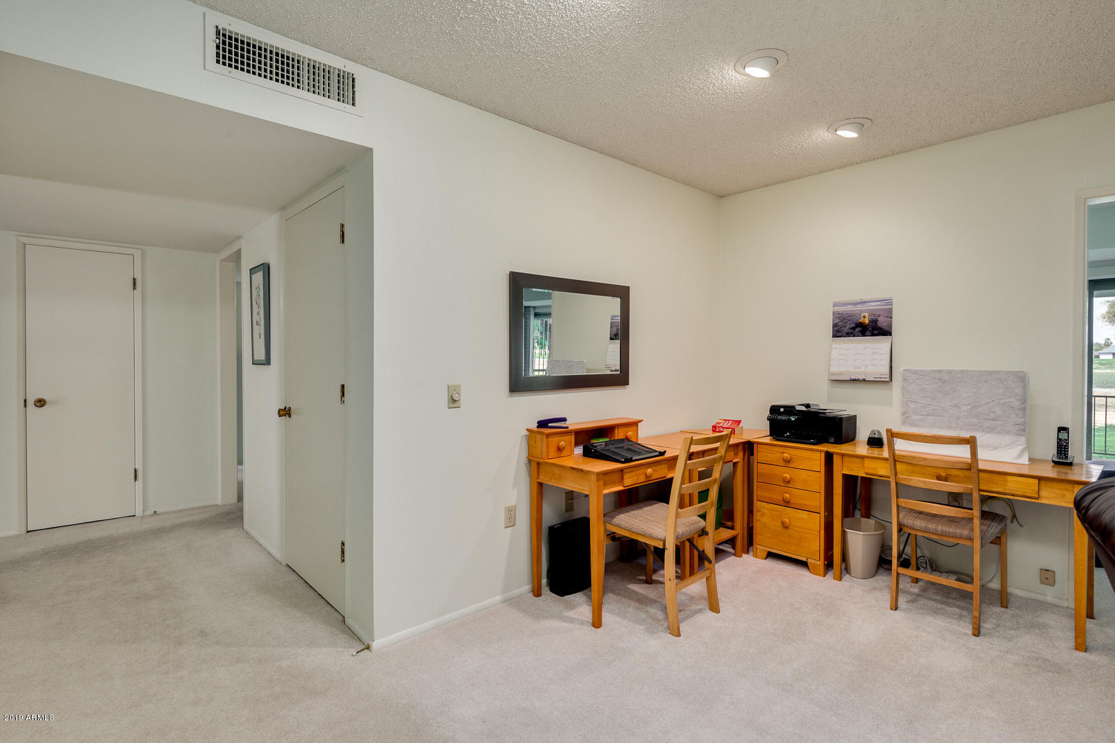 10030 West Mountain View Road Sun City, AZ 85351 - Photo 8 of 16 a view of a workspace with furniture