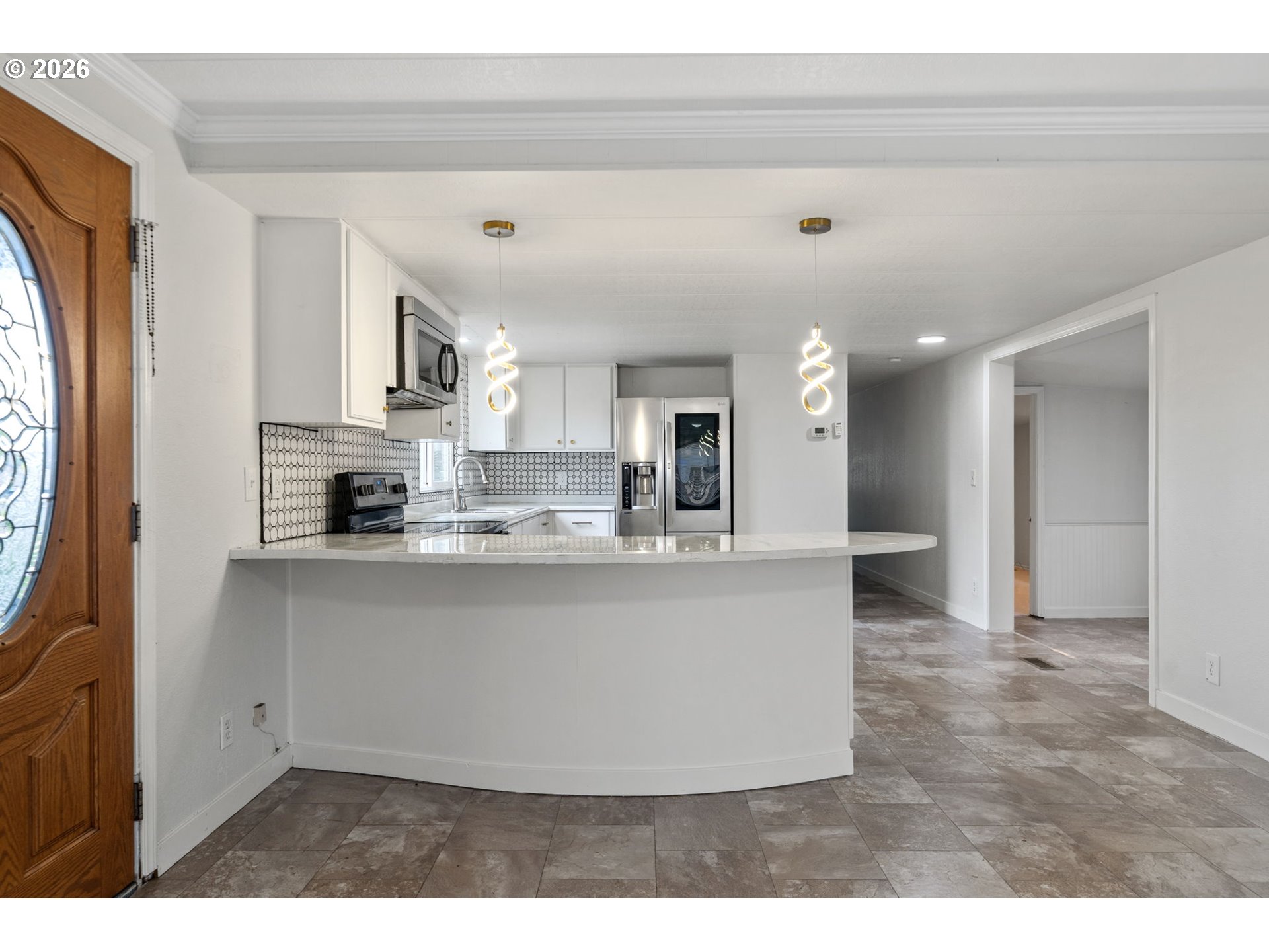 8525 Southeast Orchard Lane, Unit 91 Happy Valley, OR 97086 - Photo 11 of 35 a view of kitchen with stainless steel appliances granite countertop refrigerator sink and stove