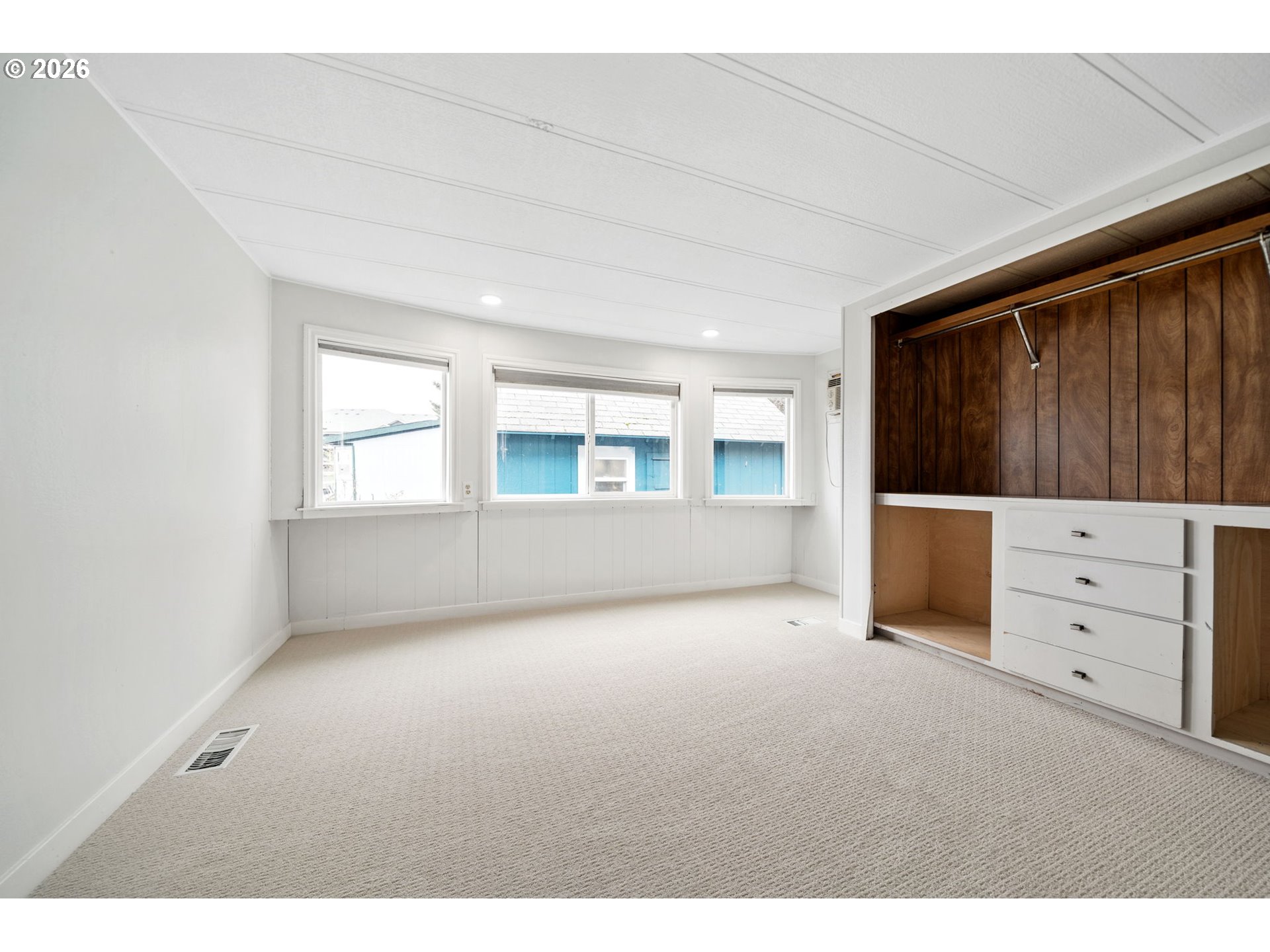 8525 Southeast Orchard Lane, Unit 91 Happy Valley, OR 97086 - Photo 18 of 35 a view of an empty room with a window