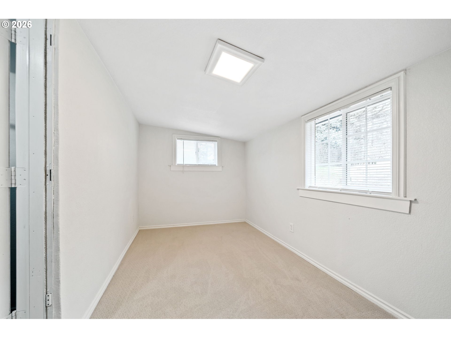 8525 Southeast Orchard Lane, Unit 91 Happy Valley, OR 97086 - Photo 19 of 35 a view of an empty room with a window