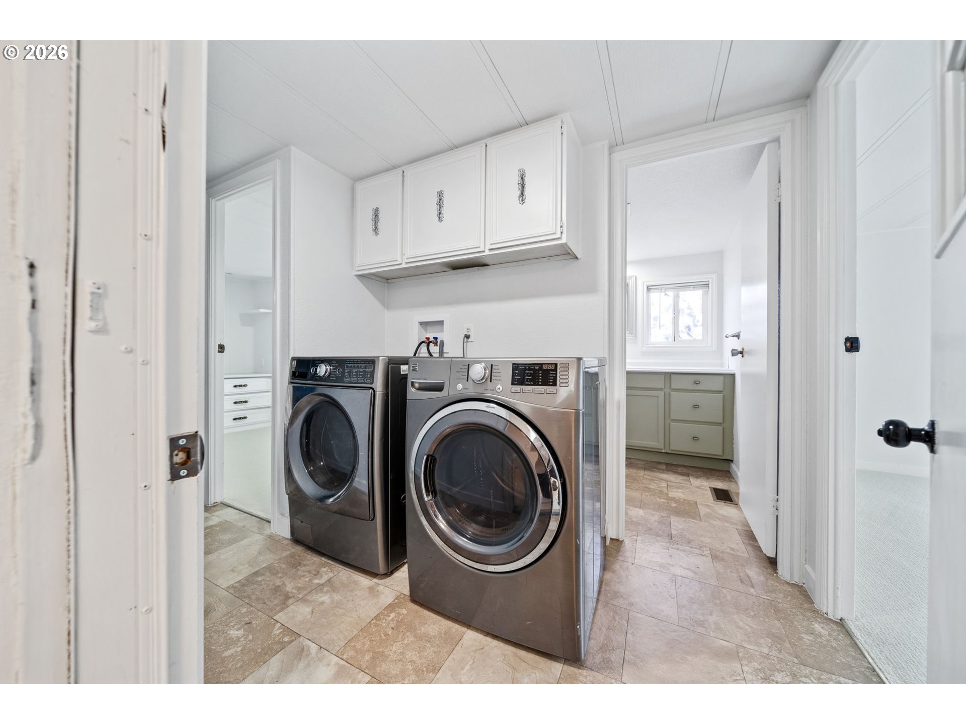 8525 Southeast Orchard Lane, Unit 91 Happy Valley, OR 97086 - Photo 22 of 35 a view of a kitchen with washer and dryer