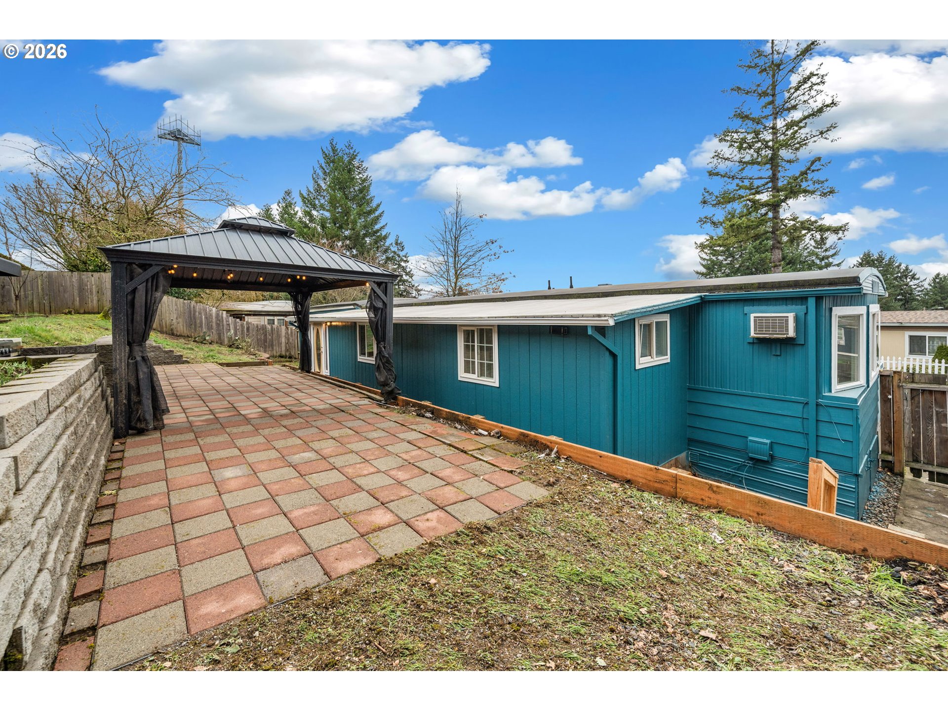 8525 Southeast Orchard Lane, Unit 91 Happy Valley, OR 97086 - Photo 32 of 35 a house view with a backyard space