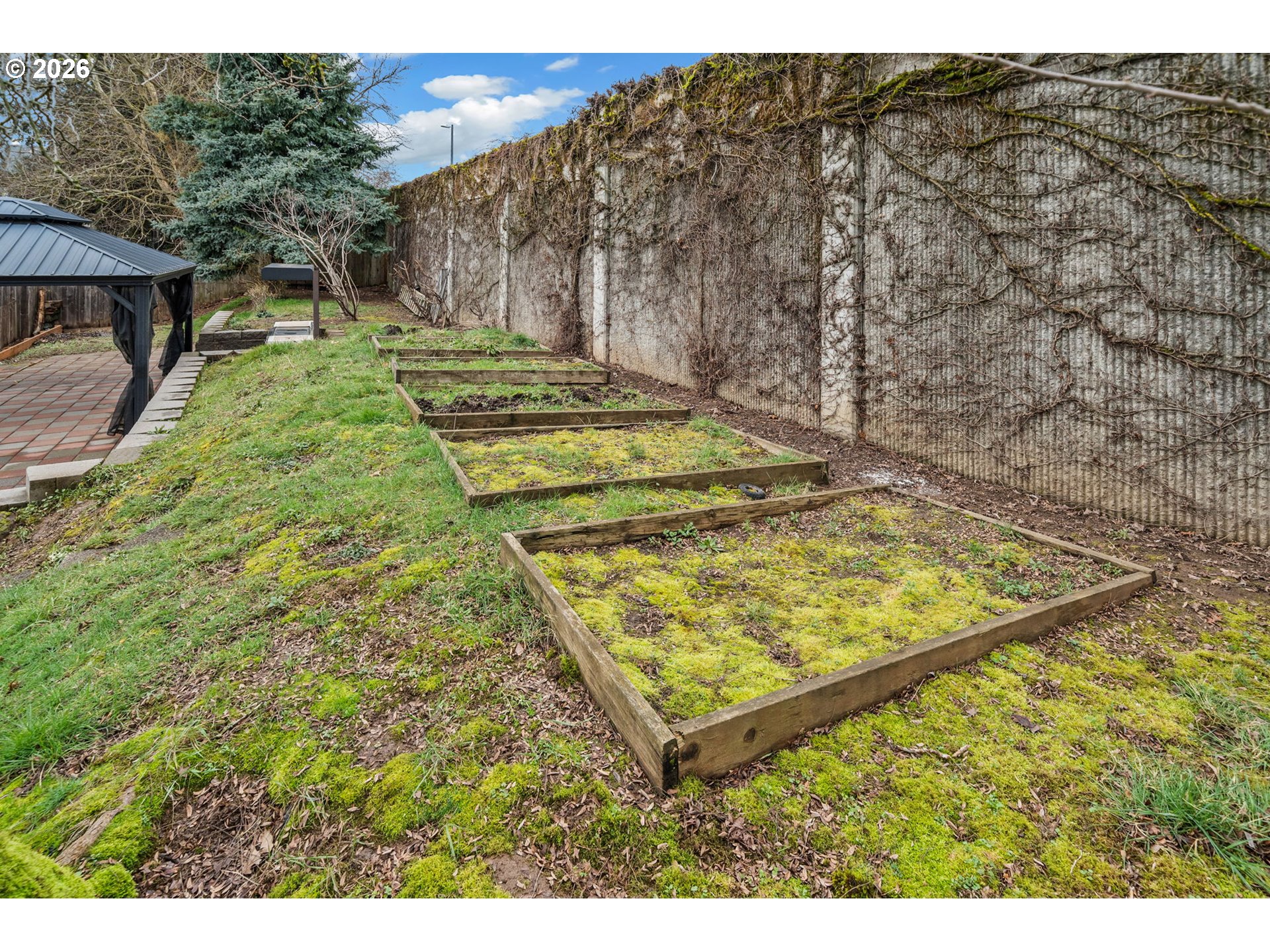 8525 Southeast Orchard Lane, Unit 91 Happy Valley, OR 97086 - Photo 33 of 35 a view of a backyard