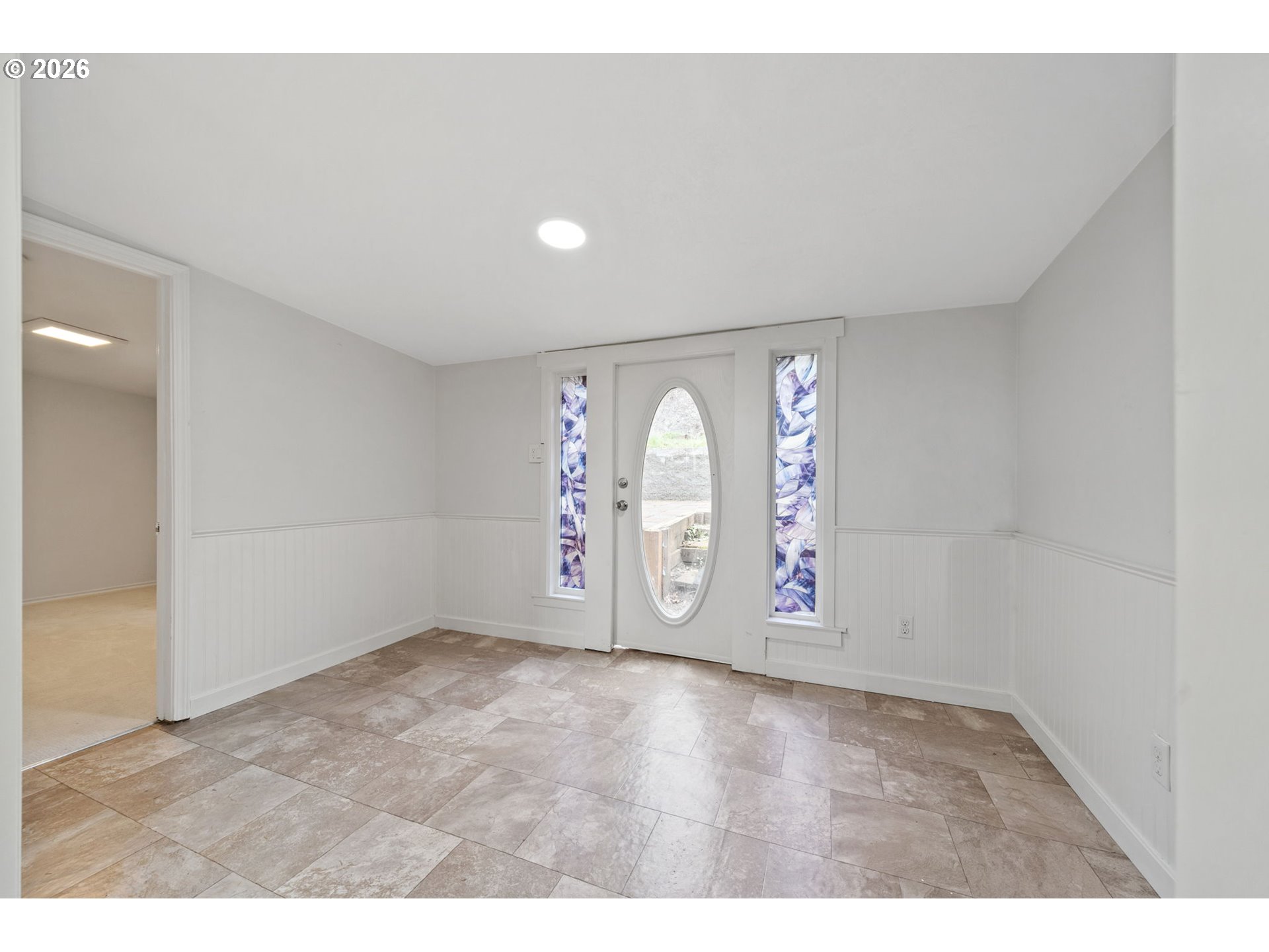 8525 Southeast Orchard Lane, Unit 91 Happy Valley, OR 97086 - Photo 5 of 35 a view of an empty room with window