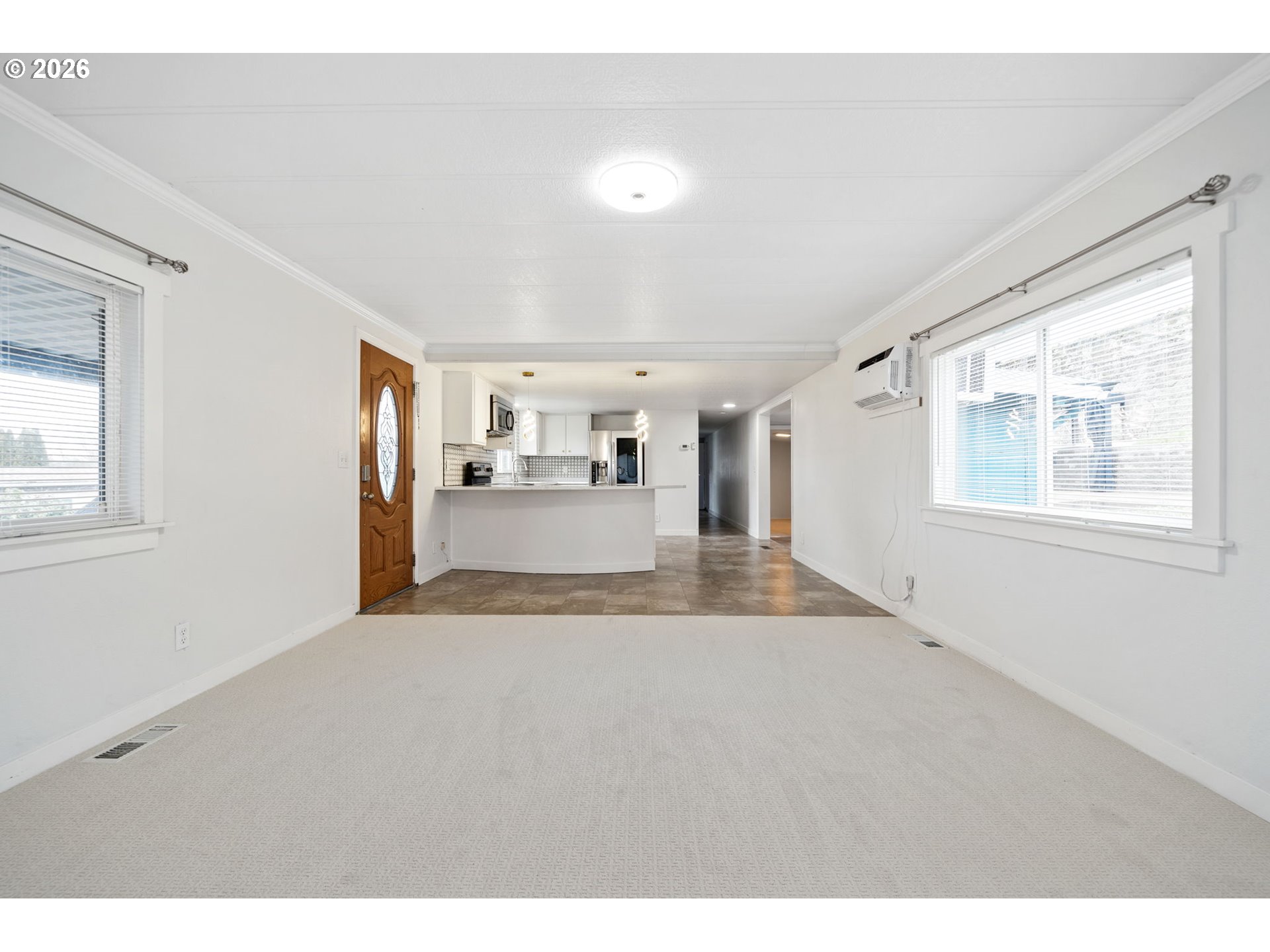 8525 Southeast Orchard Lane, Unit 91 Happy Valley, OR 97086 - Photo 8 of 35 a view of a kitchen with a sink and a window