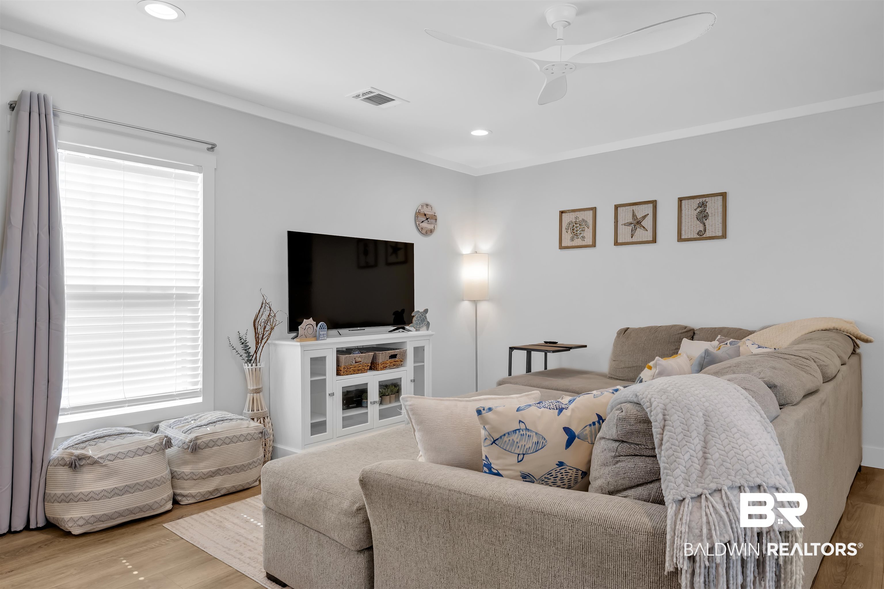 16707 Fort Morgan Road Gulf Shores, AL 36542 - Photo 8 of 22 Living room with wood finished floors, recessed lighting, ornamental molding, and a ceiling fan