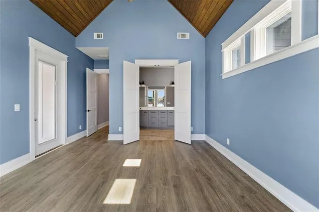 a bathroom with a double vanity sink and mirror with shower