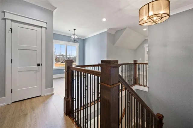 a view of room with window wooden floor and front door