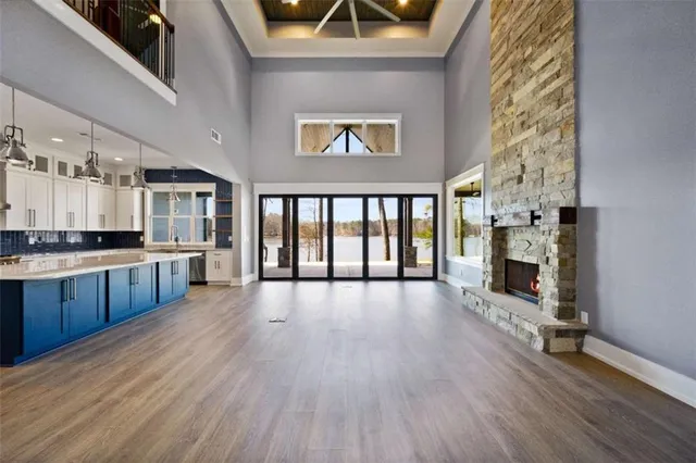a view of a kitchen with a sink and a large window