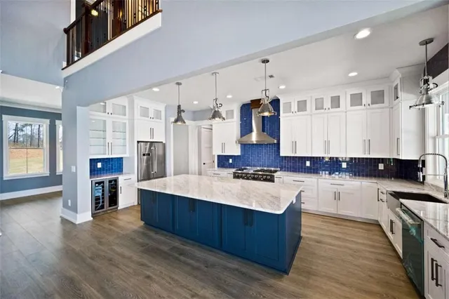 a kitchen with stainless steel appliances granite countertop a stove and a sink