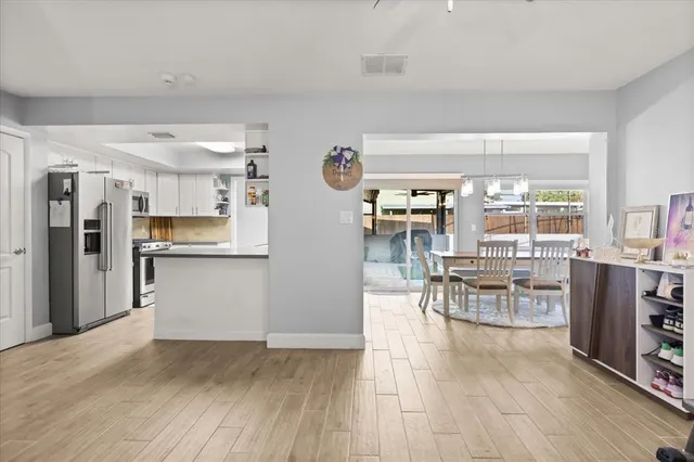 a view of a living room and dining room