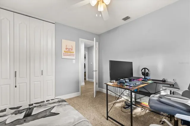 a workspace with furniture and a chandelier