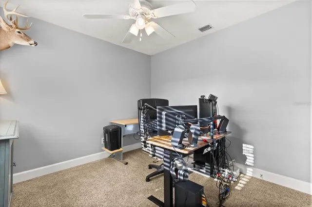 a view of a workspace with furniture