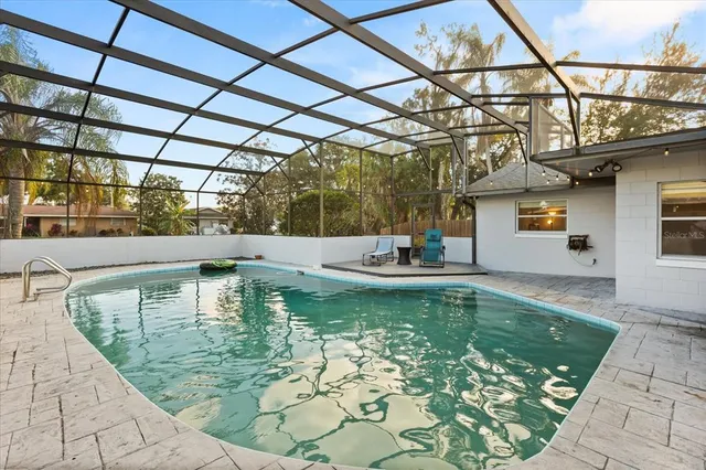 a view of a swimming pool with a patio