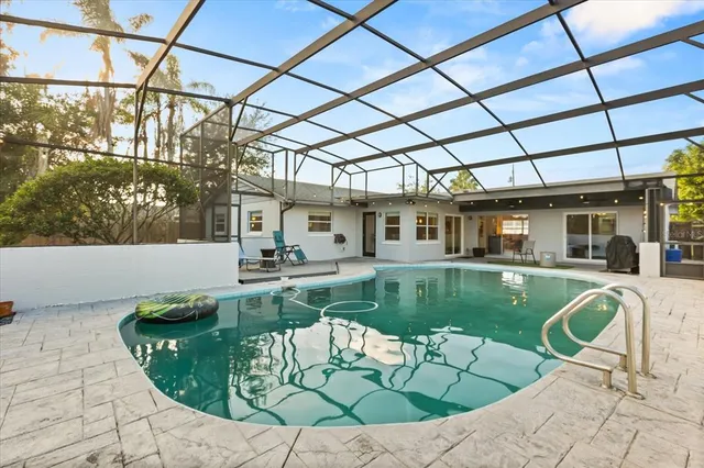 a view of a swimming pool with a patio